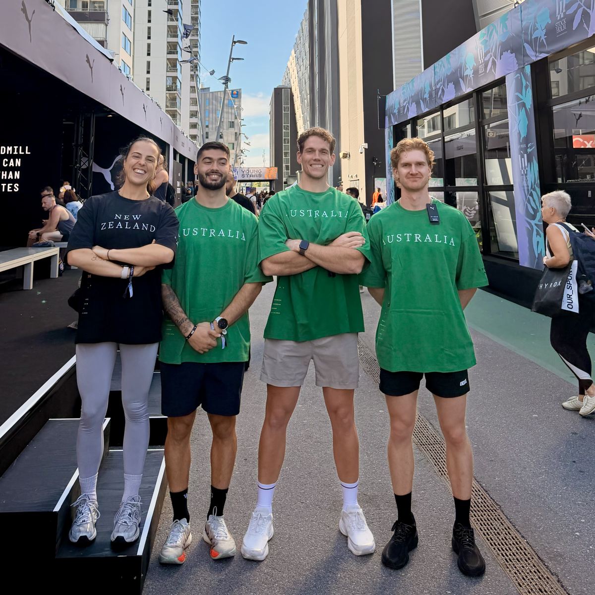 Luke and three teammates in Australia and New Zealand shirts