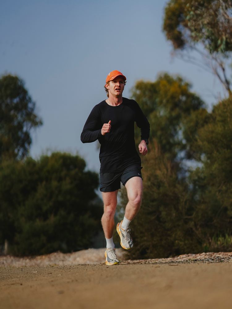 Luke running on a gravel trail