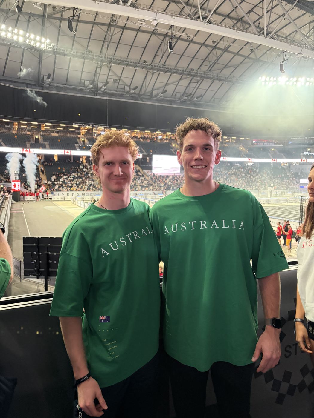 Luke and a teammate in Australia shirts inside a Hyrox arena